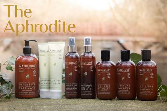 The NATULIQUE hair care range showcased in a serene natural environment. Bottles glistening in natural light, embodying the essence of organic beauty and the transformative power of certified organic ingredients