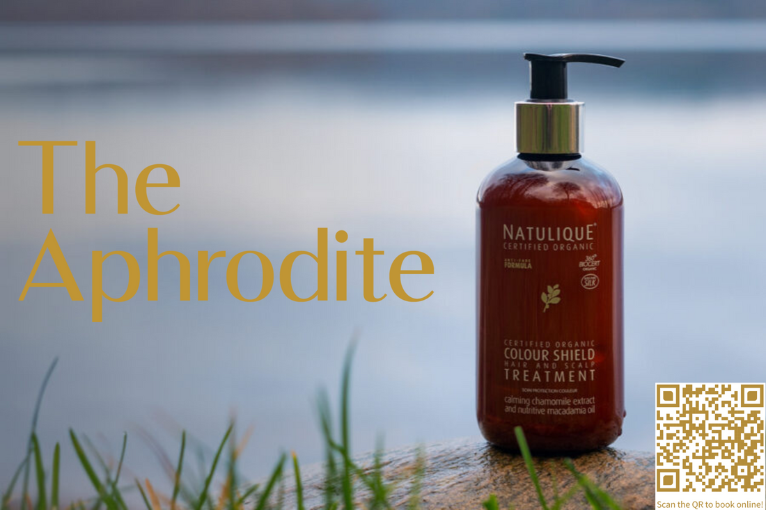 Natulique colour shield treatment promo picture for out blog Discover Your Perfect Hair Care Match: The Ultimate Guide to Natulique Shampoos and Conditioners september issue on a rock near a lake with out brand name the Aphrodite